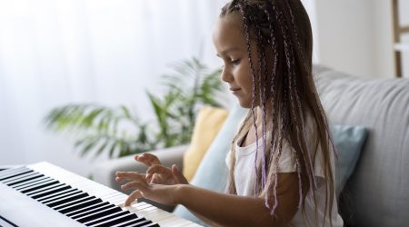 adorable-girl-playing-piano-home