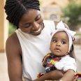 medium-shot-african-woman-holding-little-girl